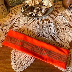 Headband, fluorescent Orange w/Green Aztec design, 9.25”x2,5”, NWOT (never used)